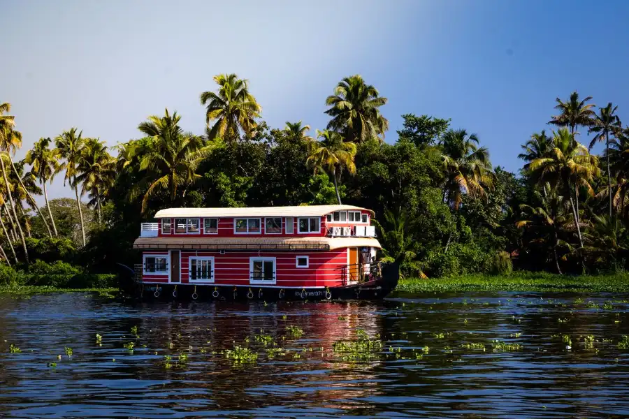 Beautiful houseboat cruising through tranquil backwaters in Kerala India