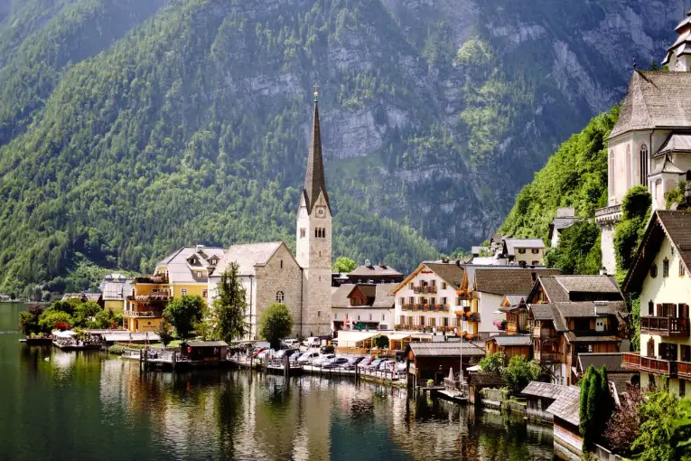 Discover the picturesque town of Hallstatt by the lake surrounded by lush alpine landscapes Austria
